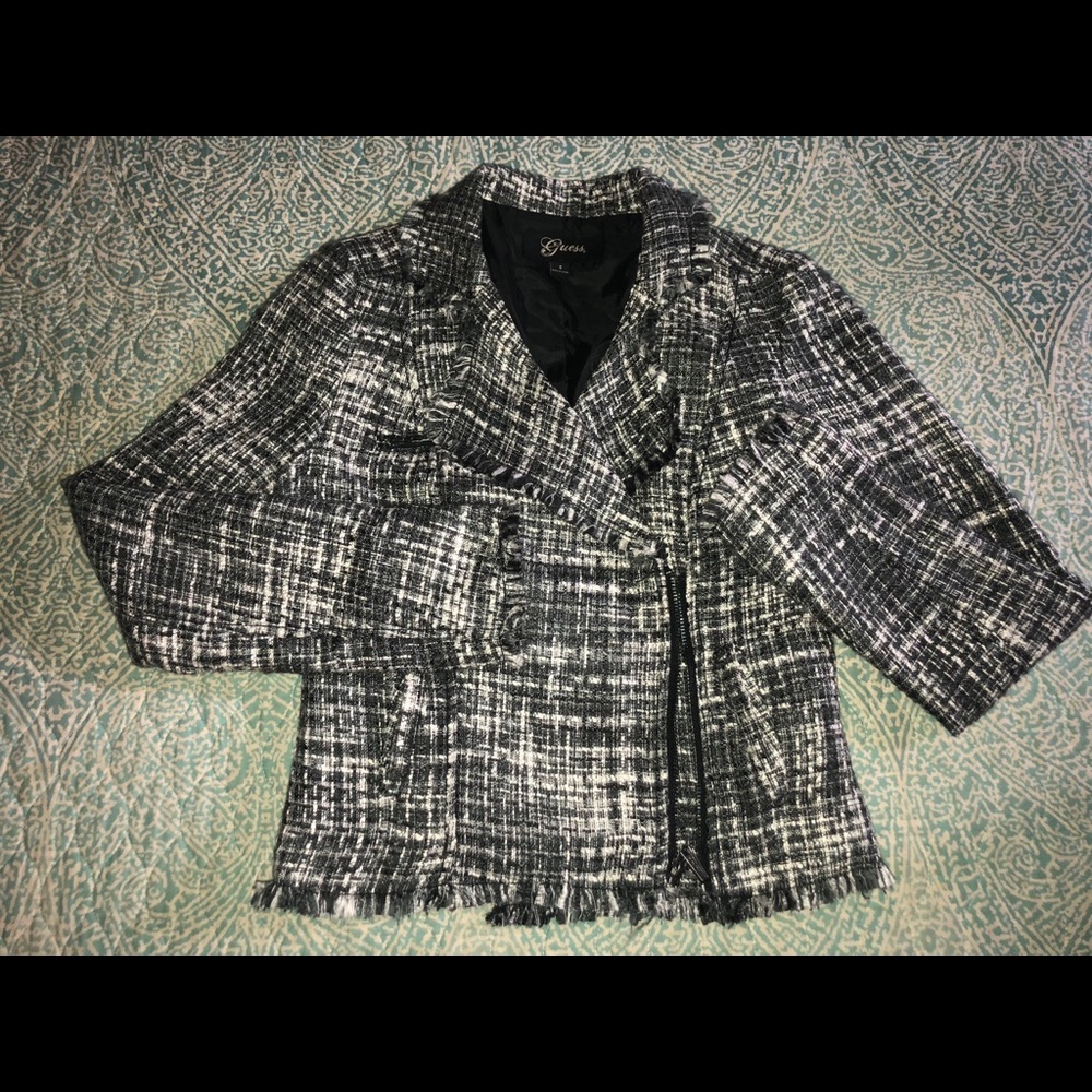 Grey blazer with white accents woven in.